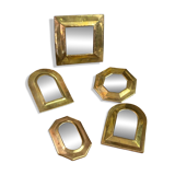 Set of five small wall mirrors in brass.