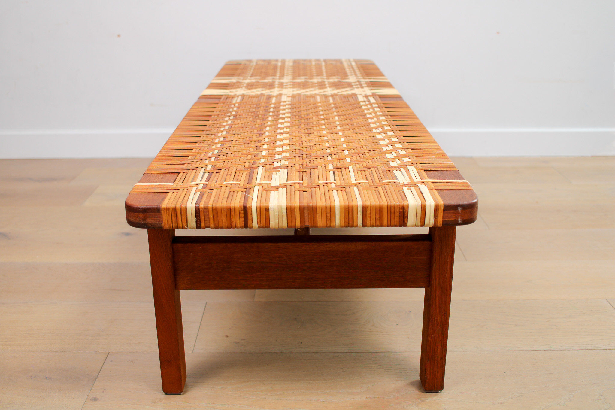 A vintage mid-century Danish Borge Mogensen 5272 rattan coffee table/bench