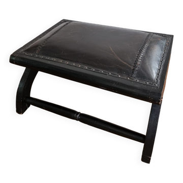 Black leather footstool with curved legs – vintage