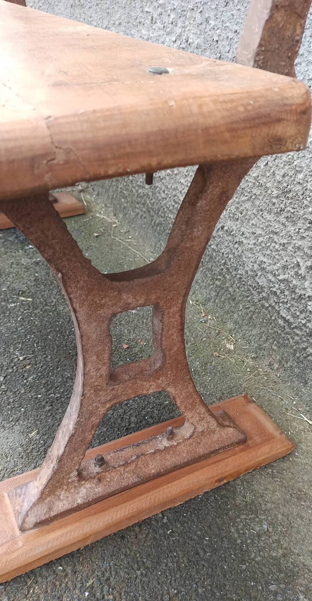 Old wooden bench with cast iron base