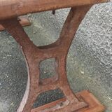 Old wooden bench with cast iron base