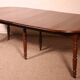 Extensible dining table from the early 19th century in walnut.