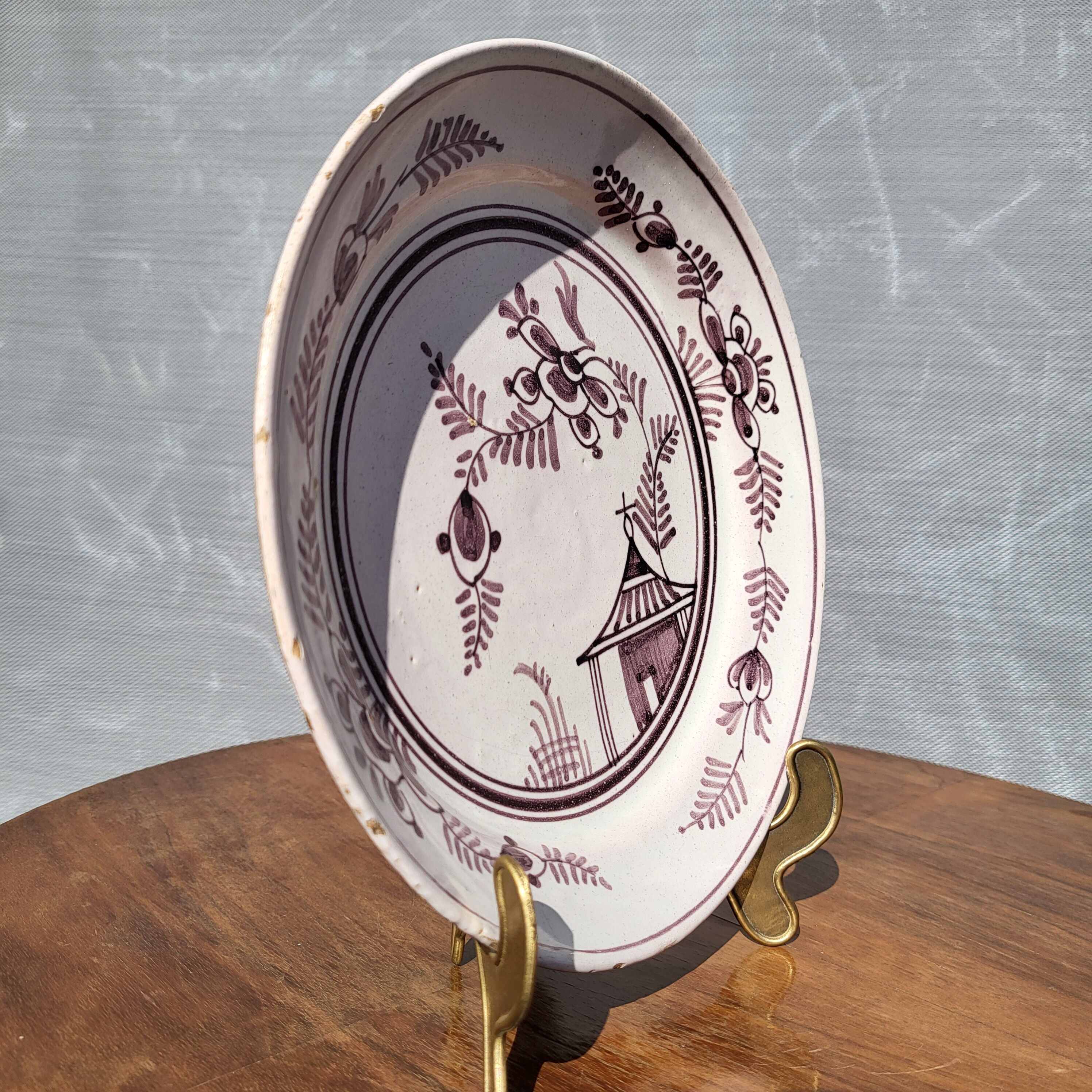 Grand Feu earthenware plate, Manganese decoration - 18th century