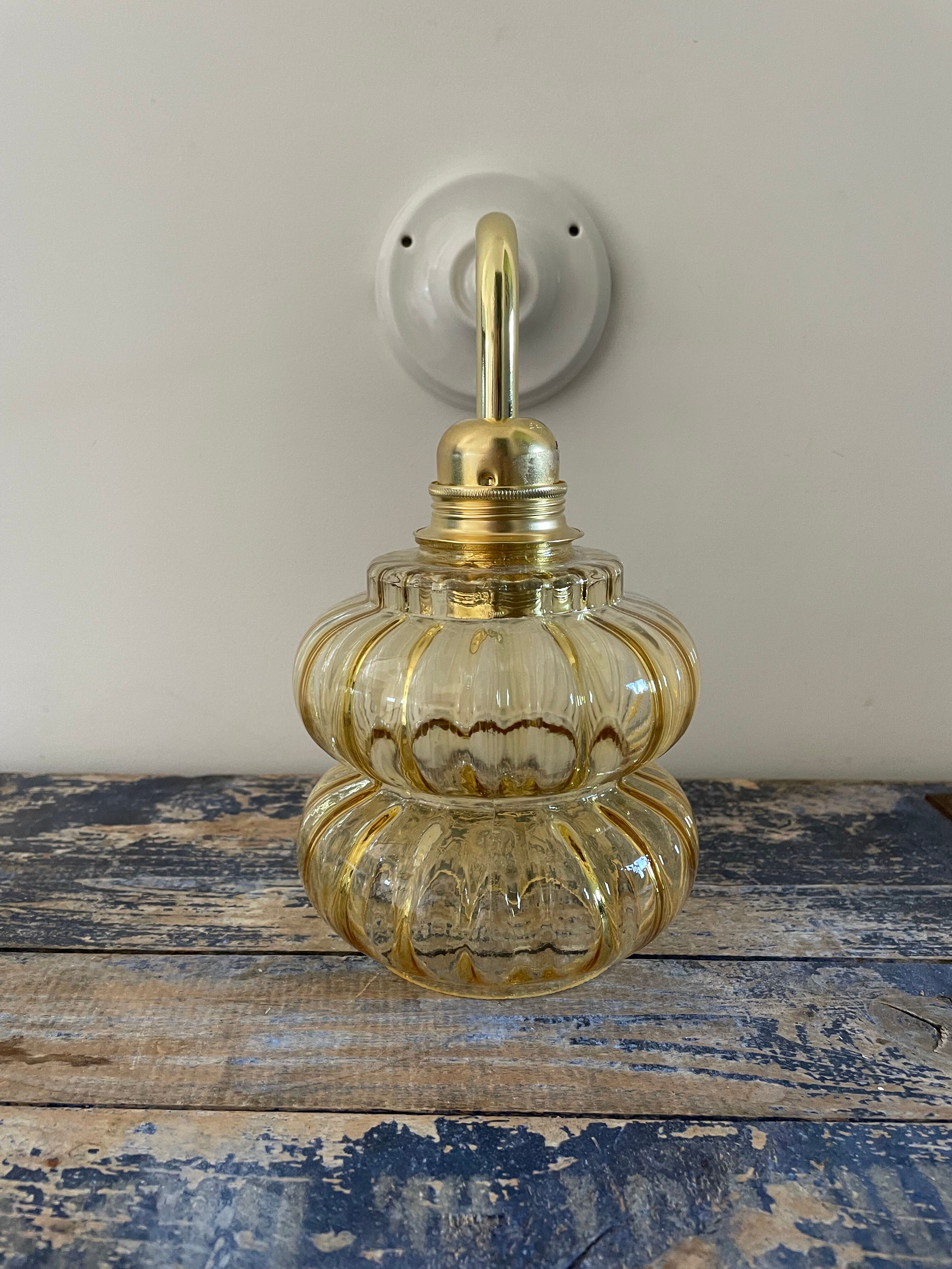Vintage wall lamp in gilded chiseled glass