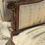 Low armchair in finely carved wood in the Louis XVI style from the 19th century