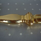 Golden metal pie shovel