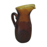 Vintage pitcher in amber glass