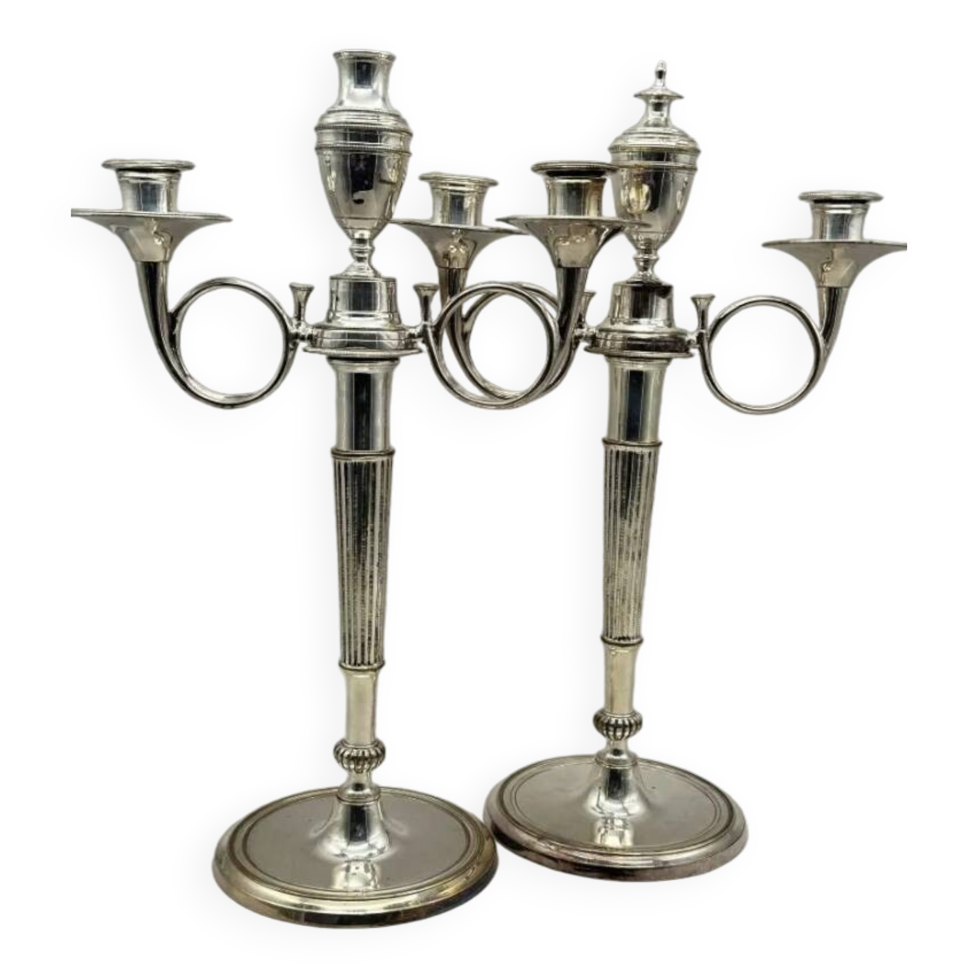 Pair of silver-plated metal candelabra decorated with hunting horns