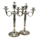 Pair of silver-plated metal candelabra decorated with hunting horns