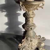 Large bronze candlestick with tripod and winged dog decoration, 19th century.