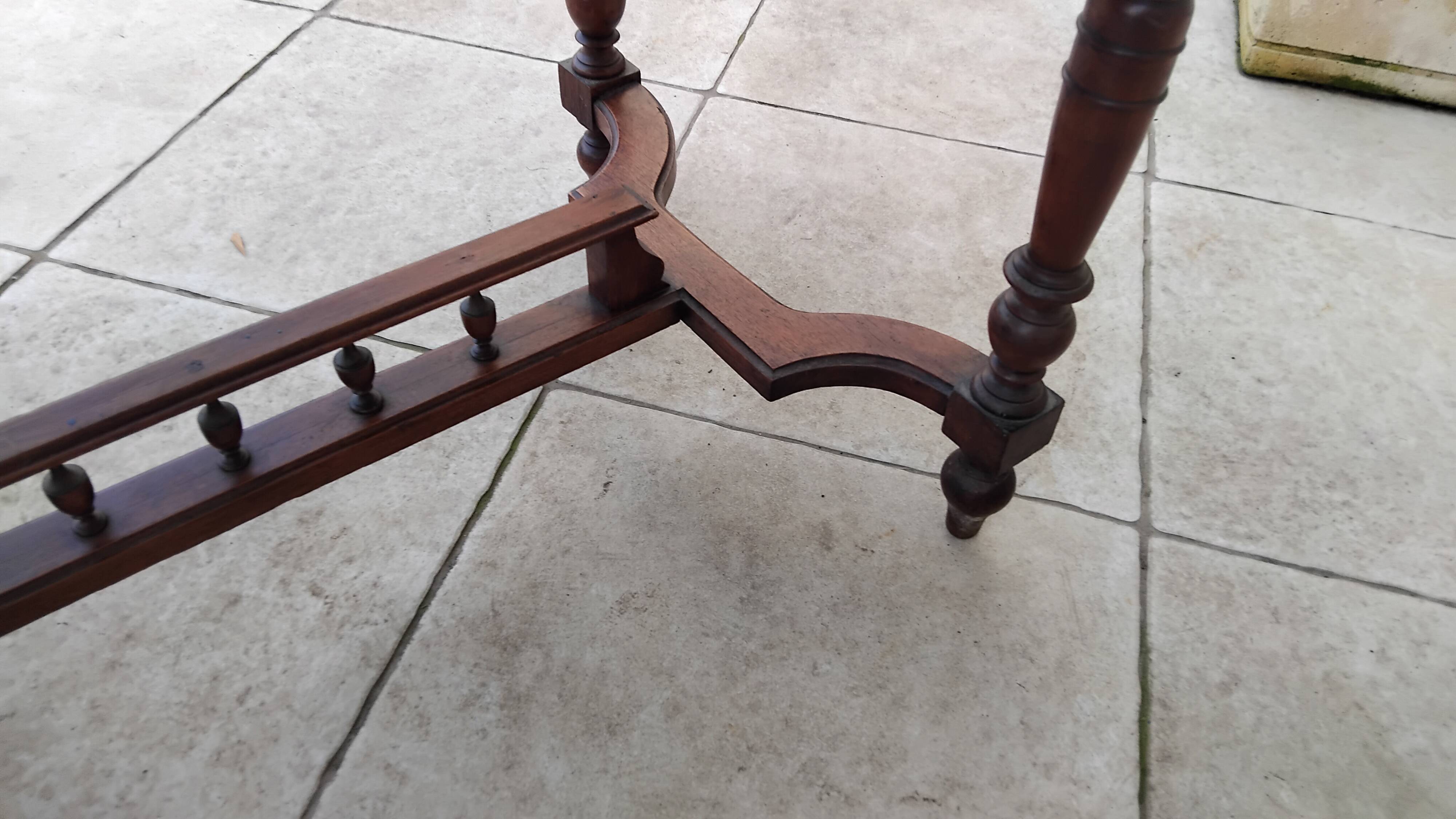 Antique desk or small table in solid carved wood