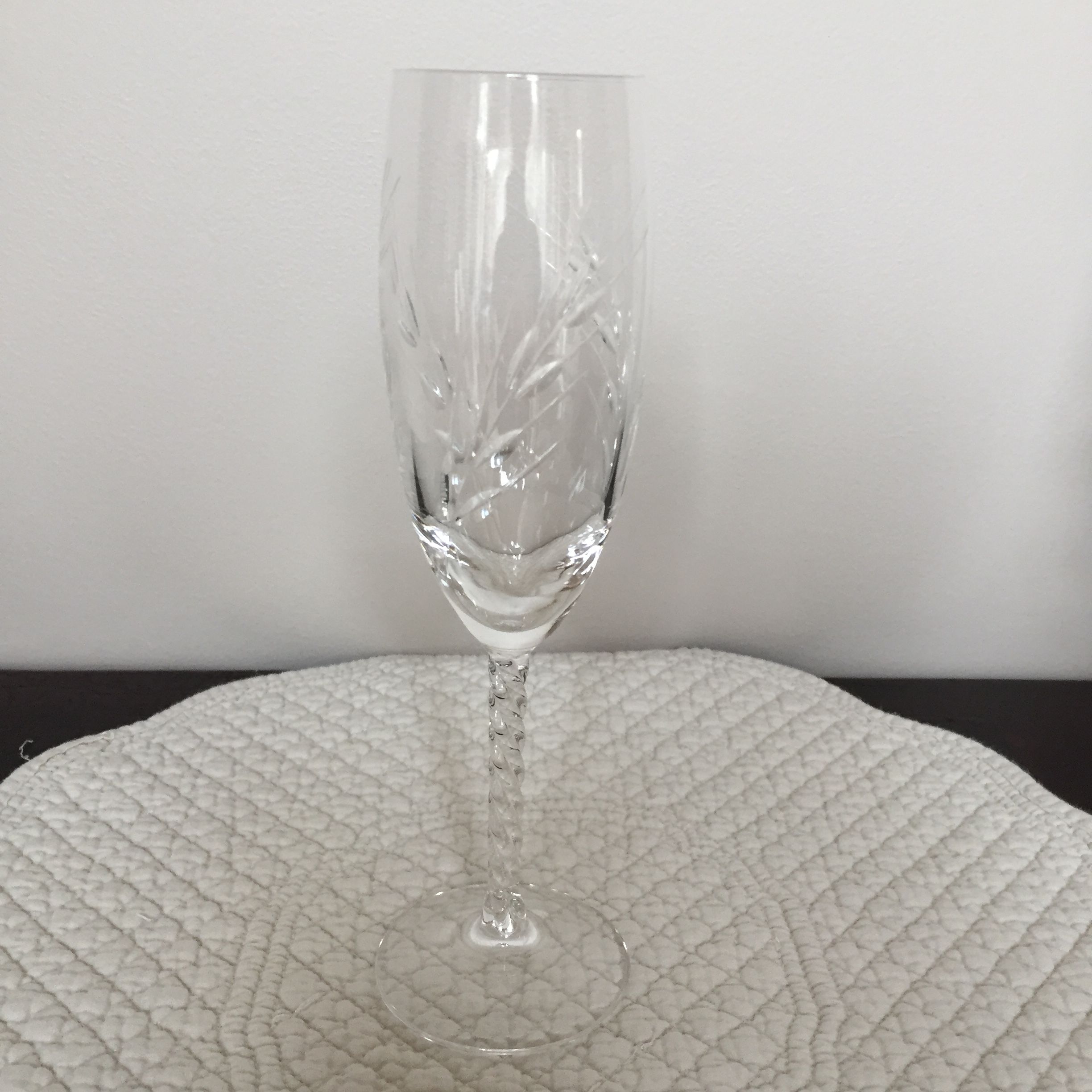 Four crystal champagne flutes engraved wheat cob patterns