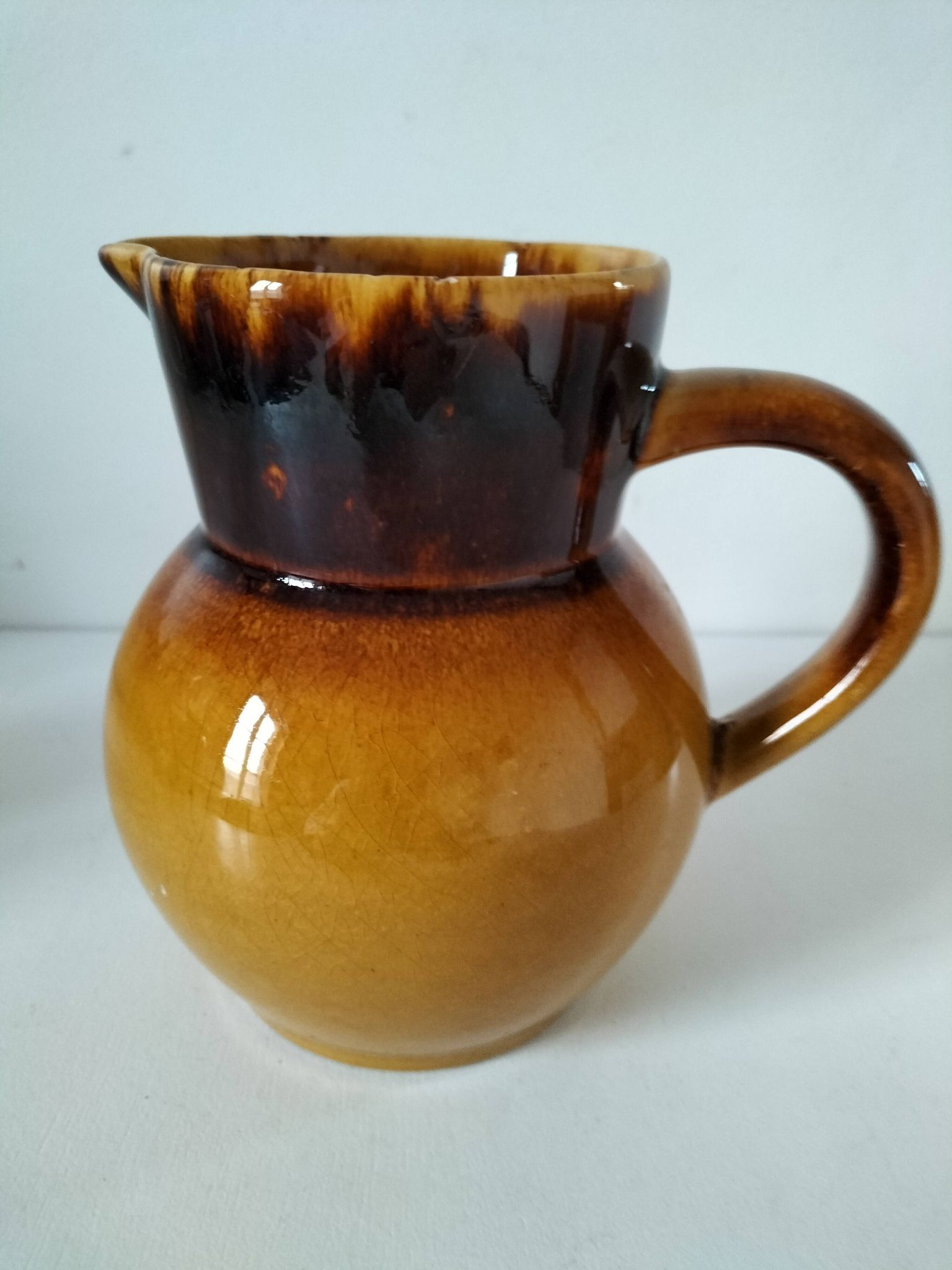 Glazed earthenware jug