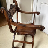 Gothic Curule Dagobert armchair in carved walnut, 19th century