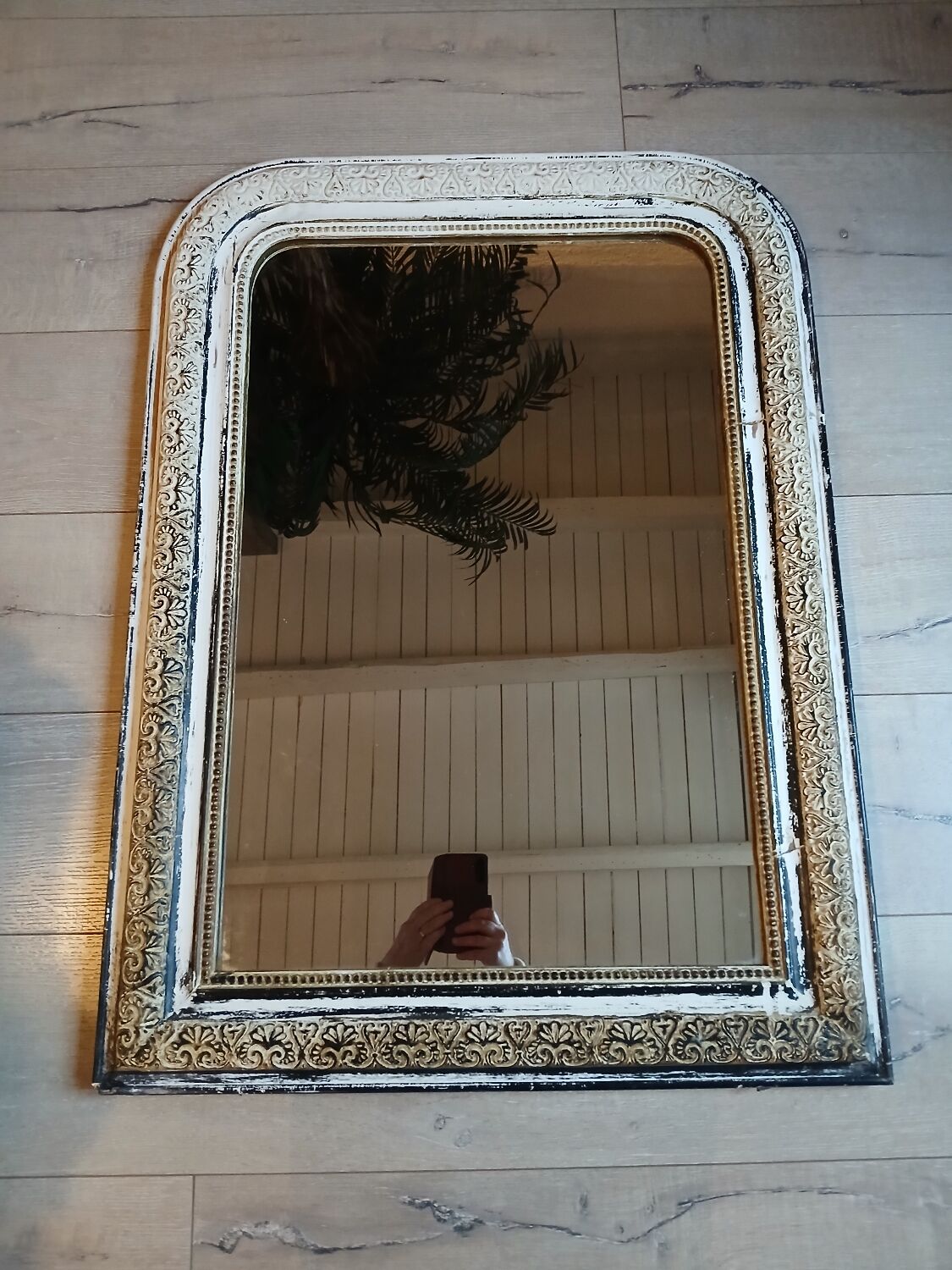 Antique mirror with carved wooden frame