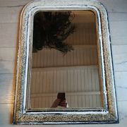 Miroir ancien avec cadre en bois sculpté 