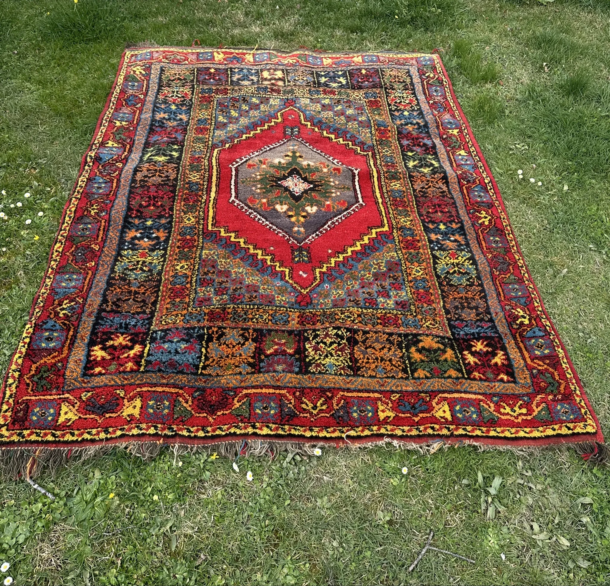 Old Moroccan carpet, made of natural wool and handwoven.