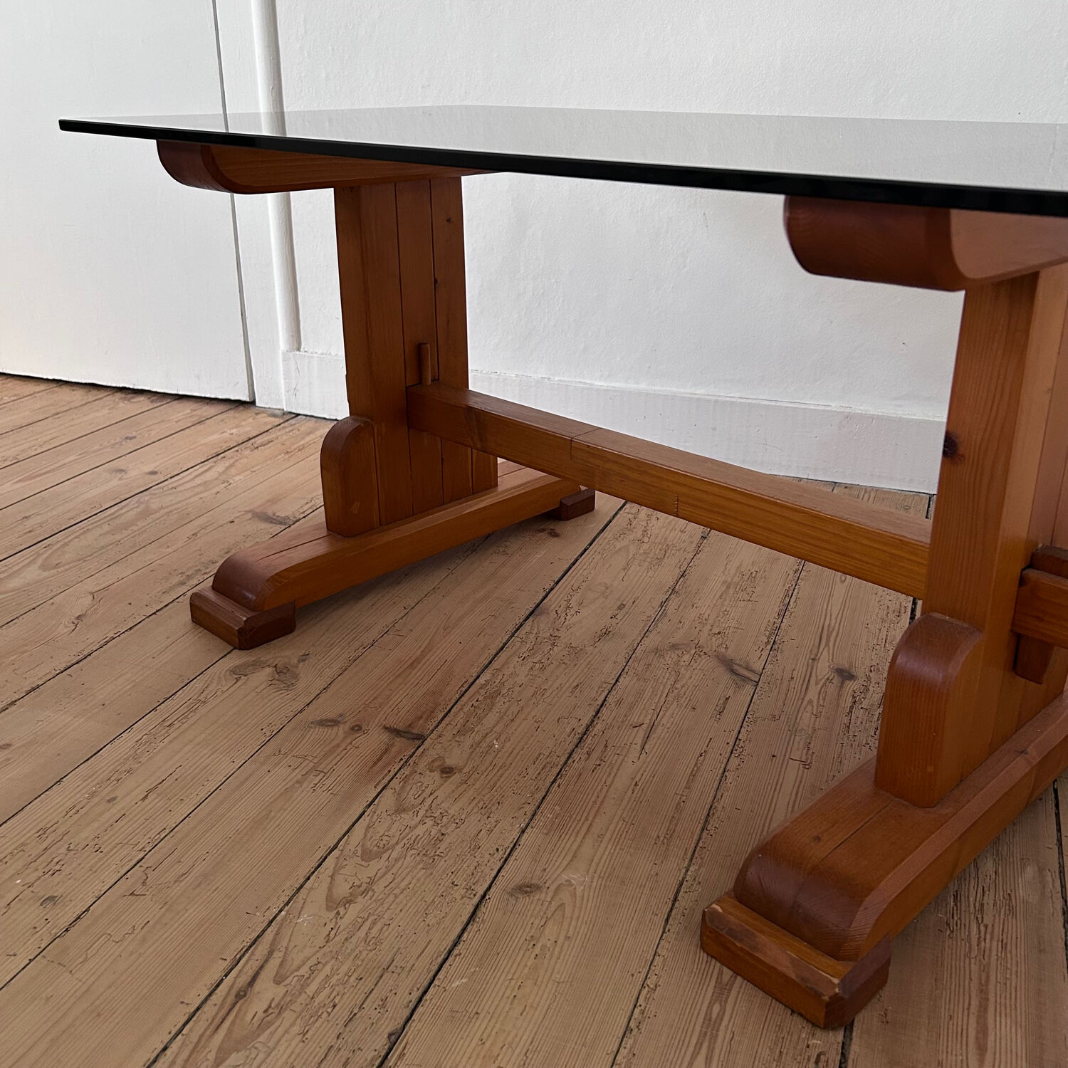 Pine coffee table with smoked glass top.
