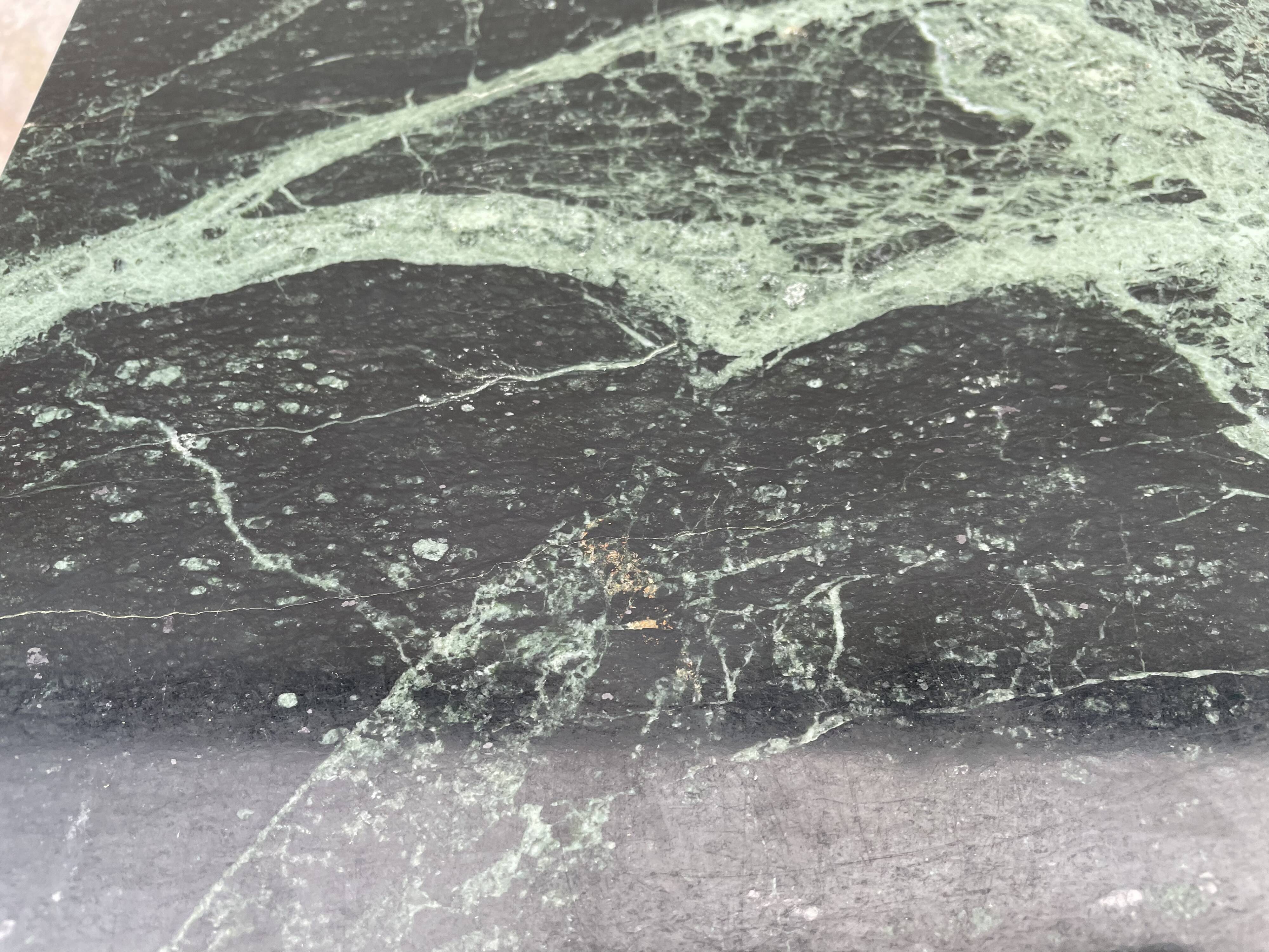 Coffee table in gilded brass and veined green marble