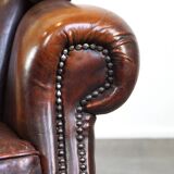 Luxurious sheepskin armchair with a fixed seat cushion and high seating comfort