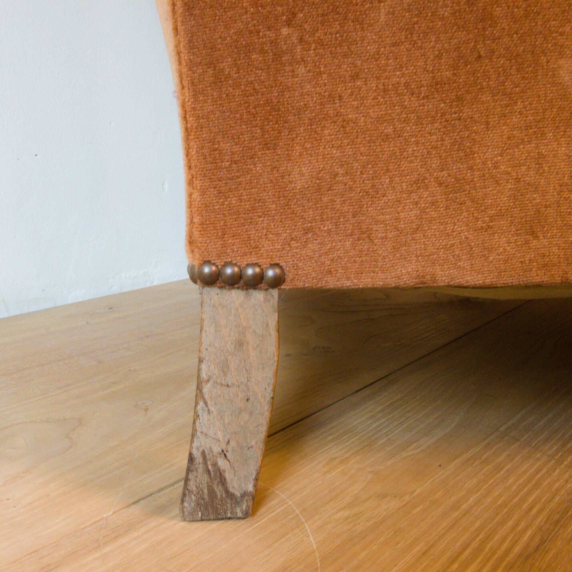 Art Deco club armchair in wood and rust brown velvet, circa 1930.