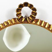 Round wall mirror in gilded wood, mid-century, C. Allodi & G. Subelli, Italy, 1950s.