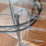 Glass and metal table and its 4 wicker chairs and glass Roche Bobois