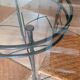 Glass and metal table and its 4 wicker chairs and glass Roche Bobois