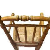 Antique bamboo caned baby chair from the early 20th century.