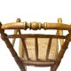 Antique bamboo caned baby chair from the early 20th century.