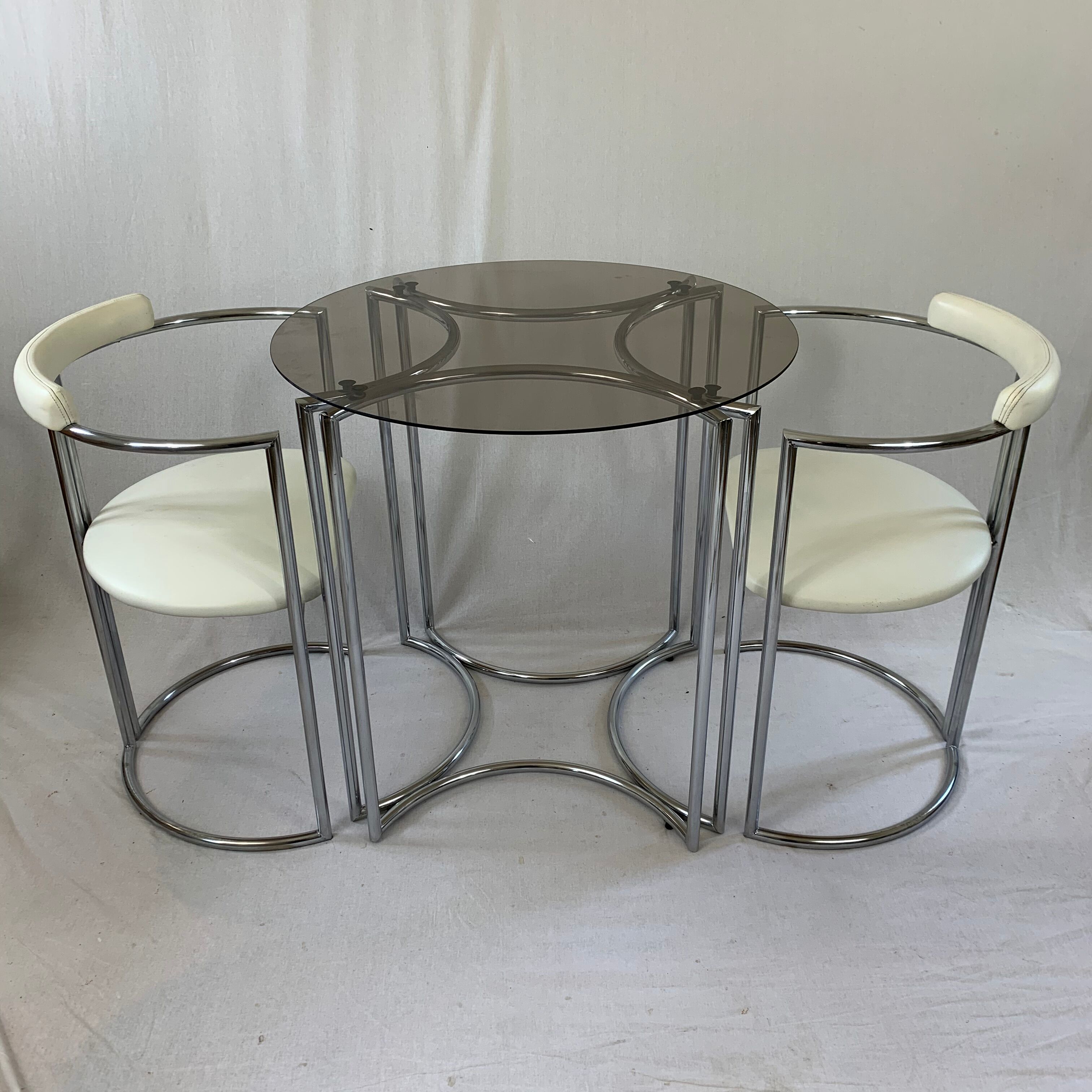 Chrome table and two modernist chairs