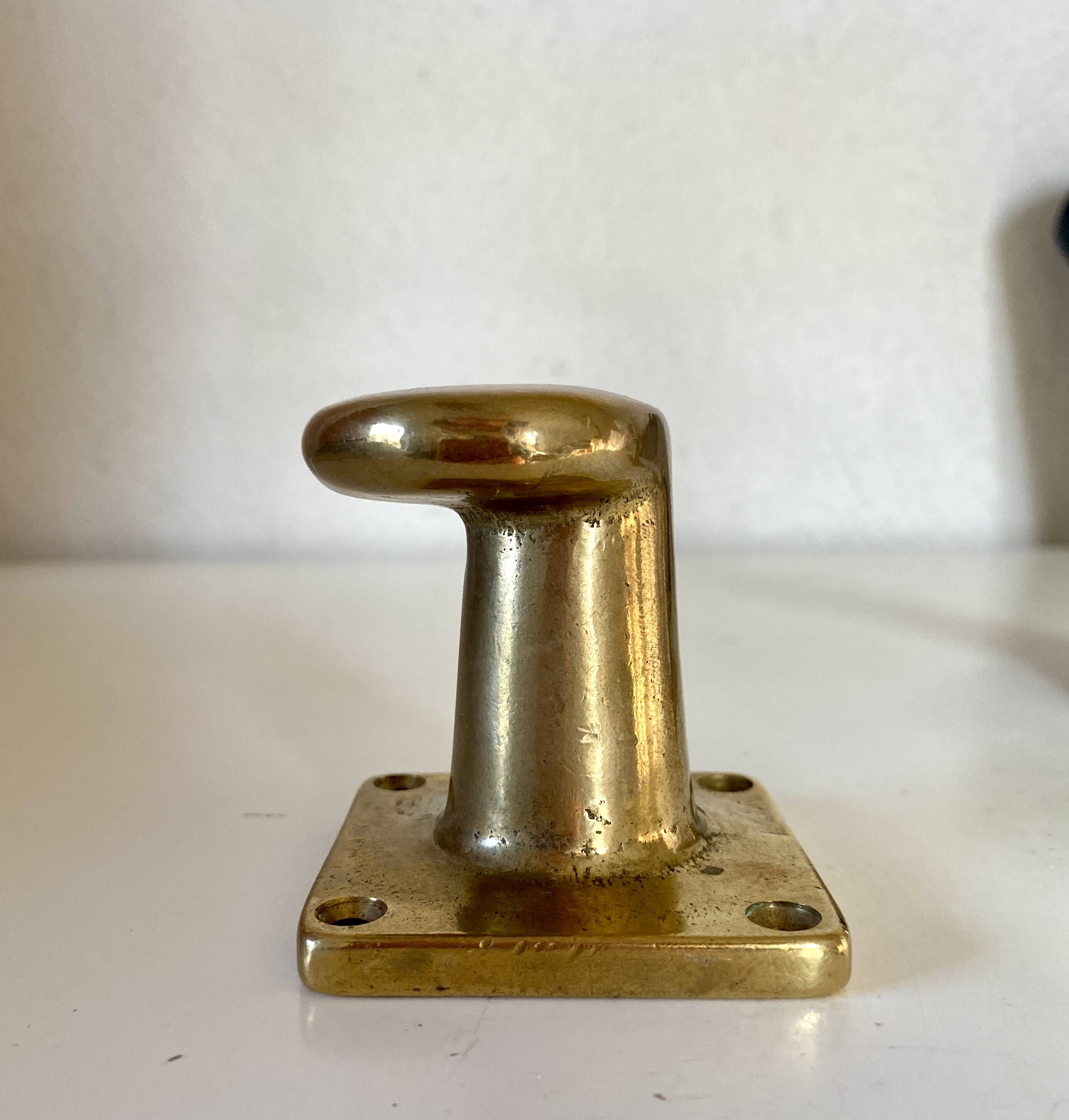 Pair of golden cast iron hooks