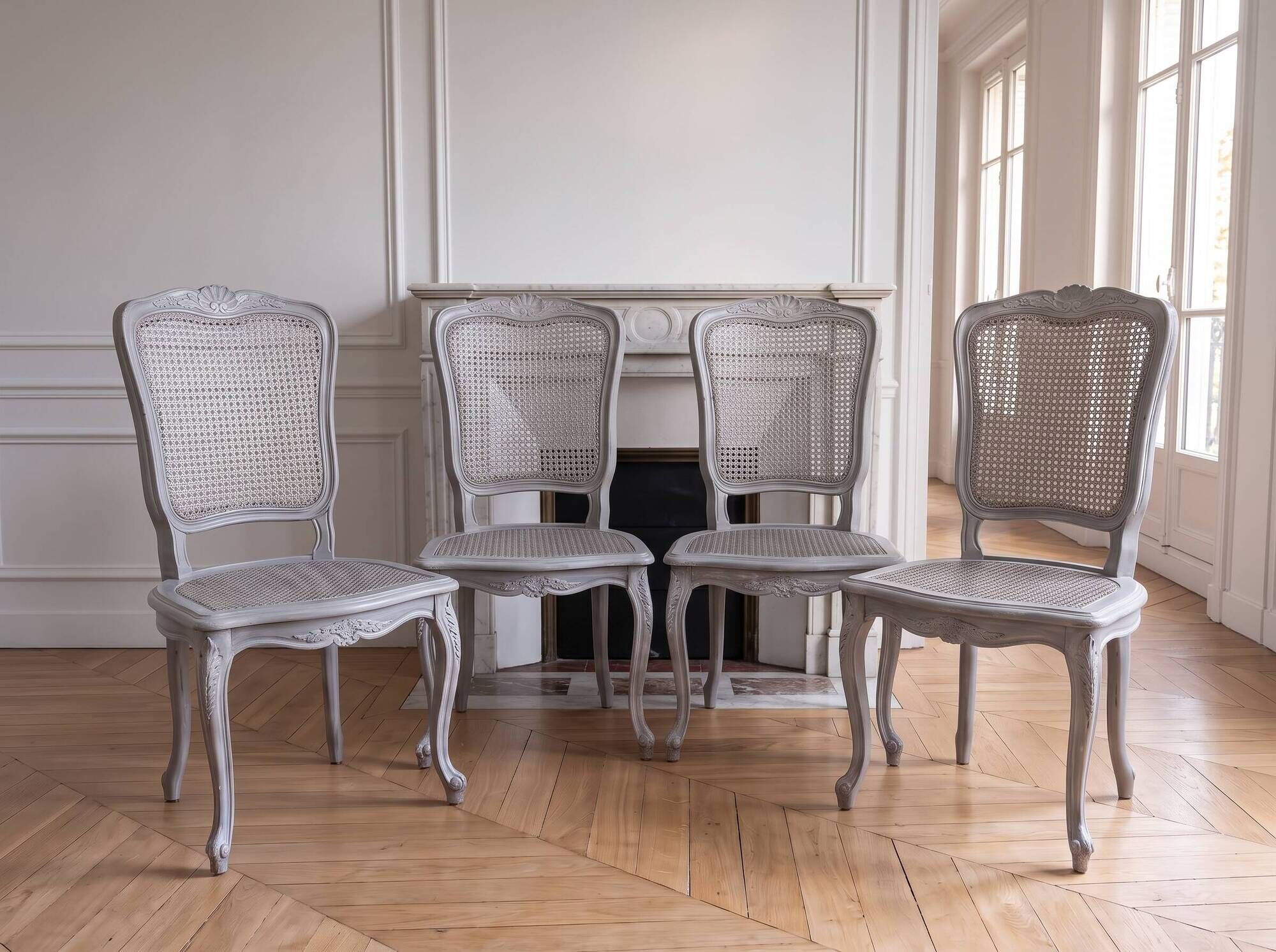 Set of 4 Louis XV chairs with light grey patinated caning.