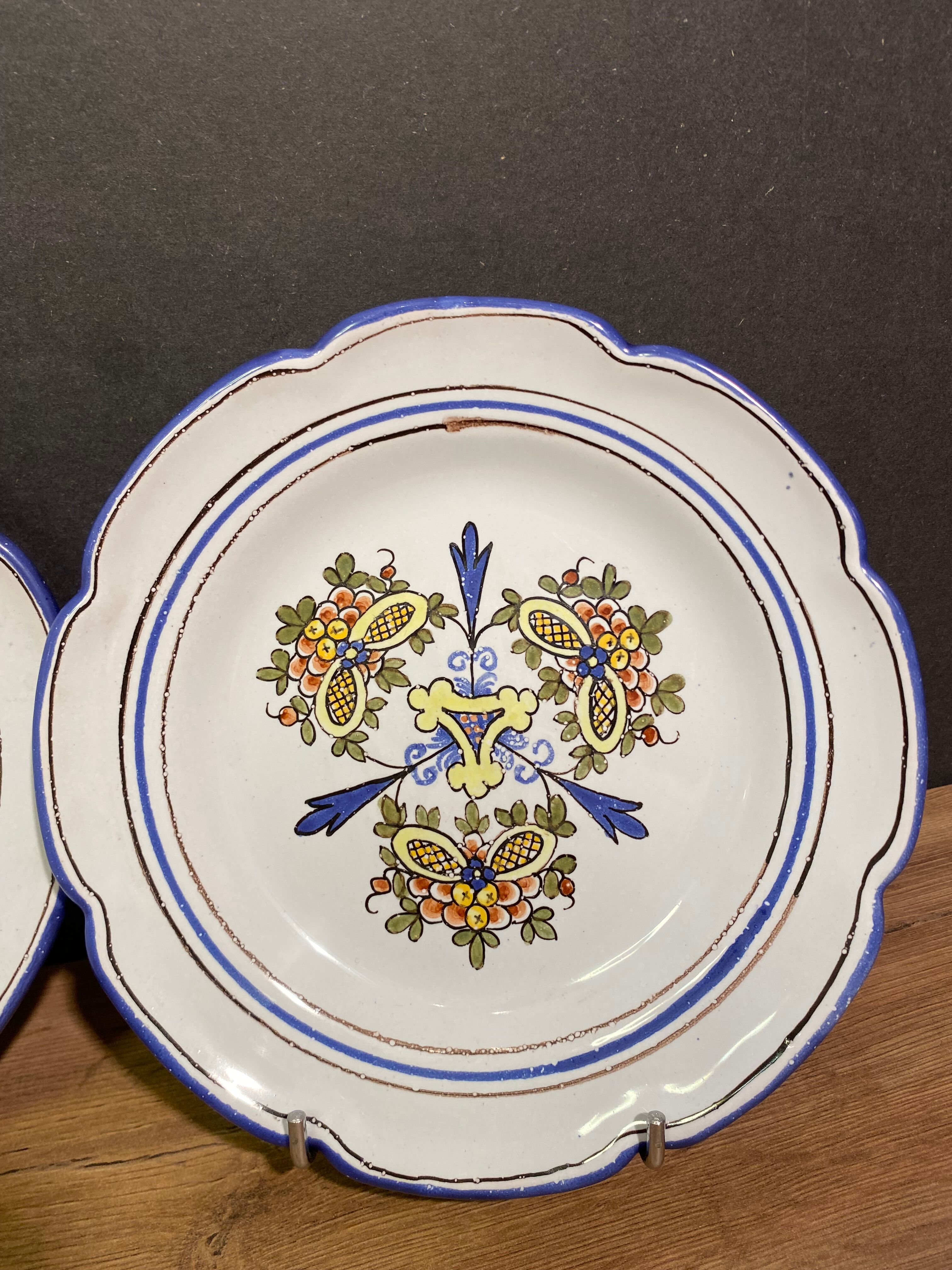 Pair of Nevers earthenware plates signed Georges