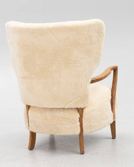 Danish armchair. upholstered with Australian lambskin. Danish Cabinmaker, 1940's
