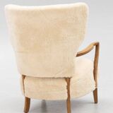 Danish armchair. upholstered with Australian lambskin. Danish Cabinmaker, 1940's