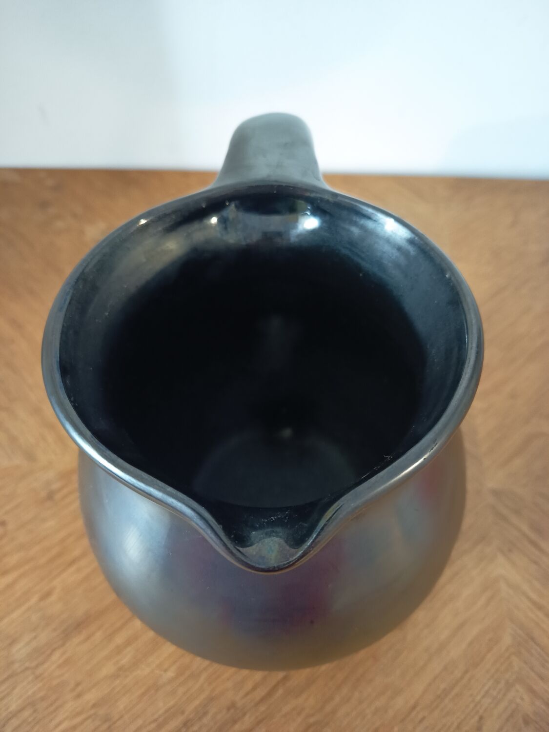 Black ceramic tripod jug