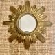 Miroir soleil doré