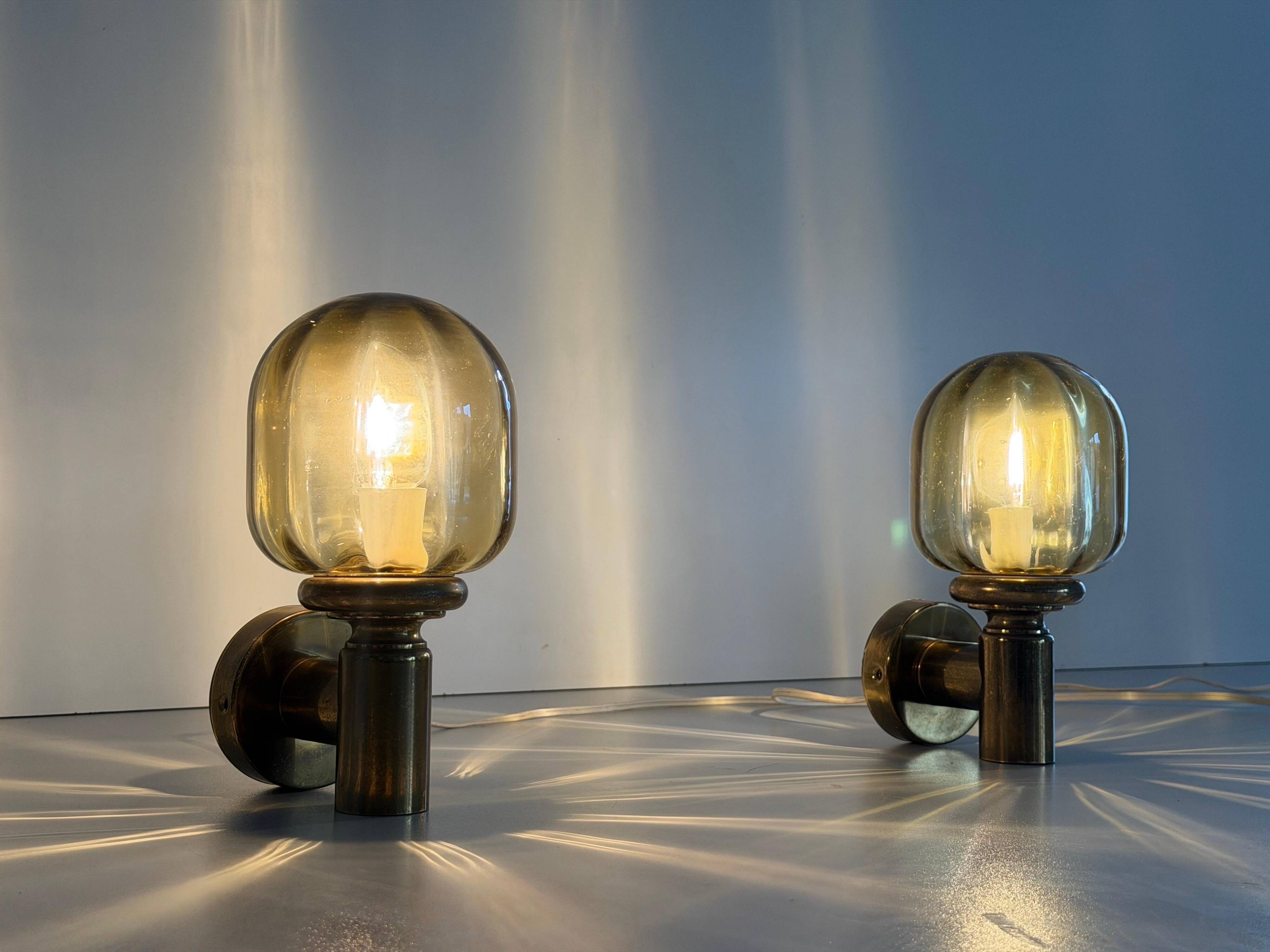 Pair of yellow glass and brass wall lights from the mid-century by N Leuchten, 1960s, Germany.