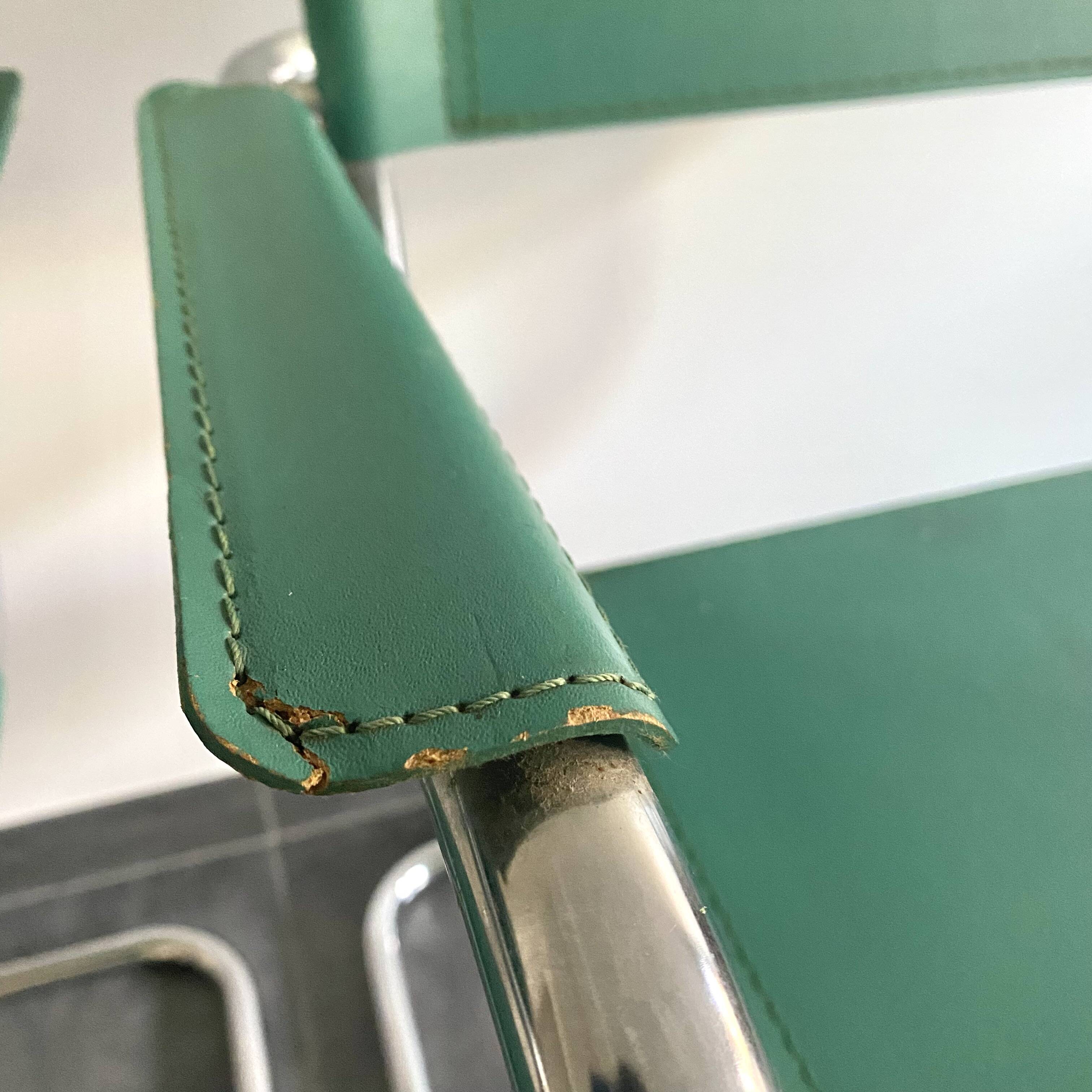 Pair of faux leather and chrome armchairs