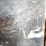 White veined black marble fireplace