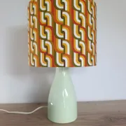 Seventies spirit lamp with geometric orange/green lampshade.