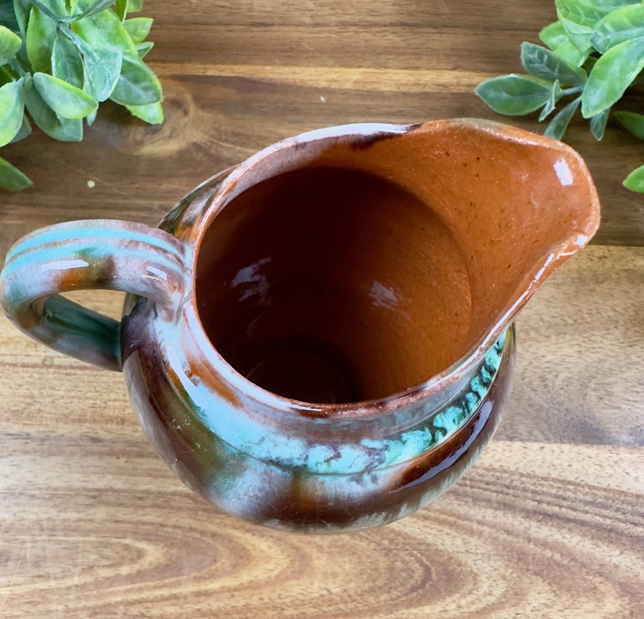 Old ceramic jug with glazed finish – flame decoration