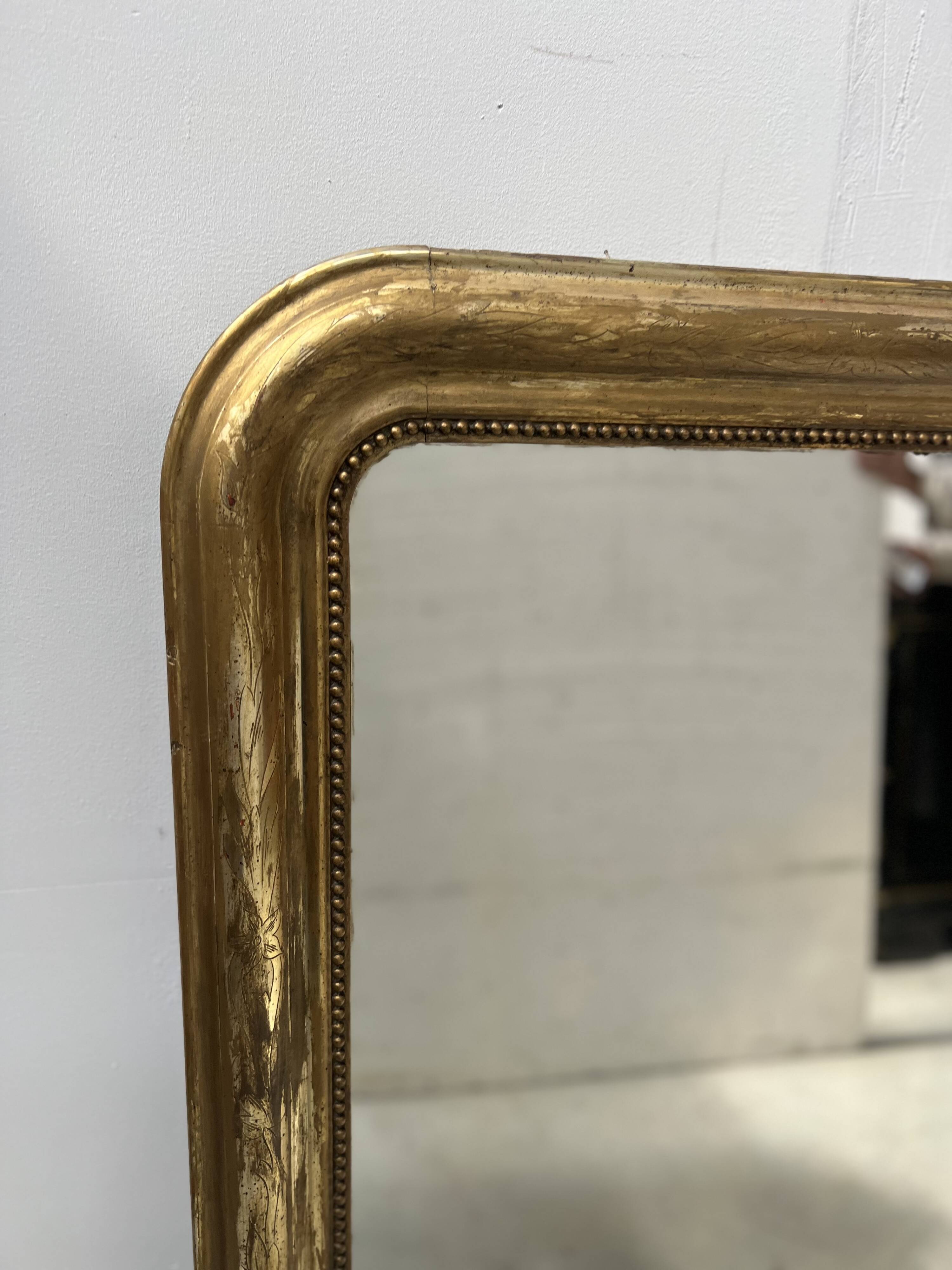 Louis Philippe mirror in wood and gilded stucco, 19th century