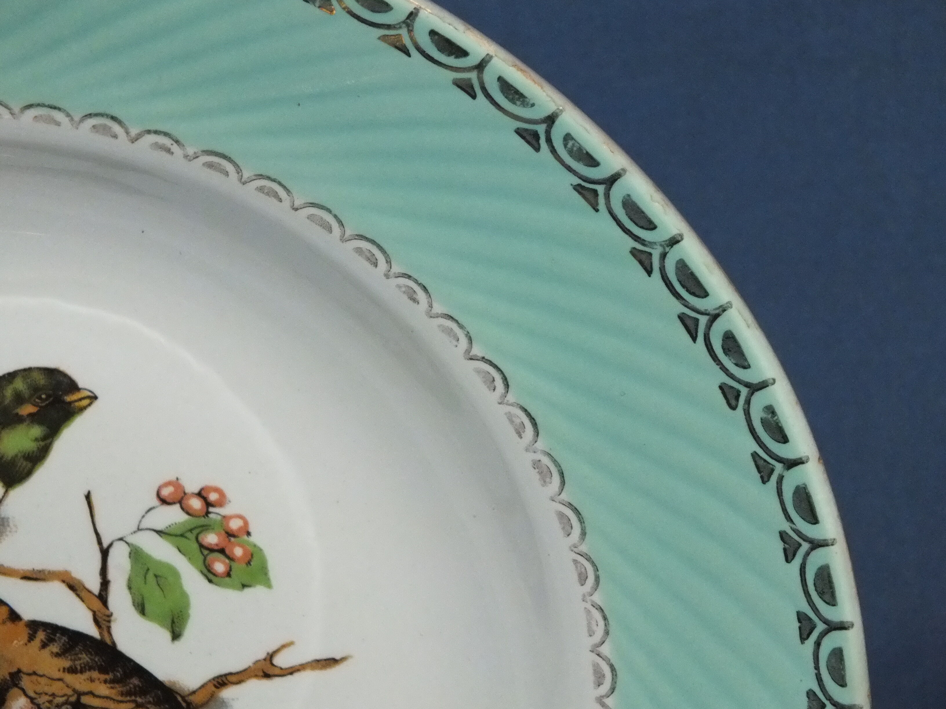 4 vintage hollow plates decorated with birds