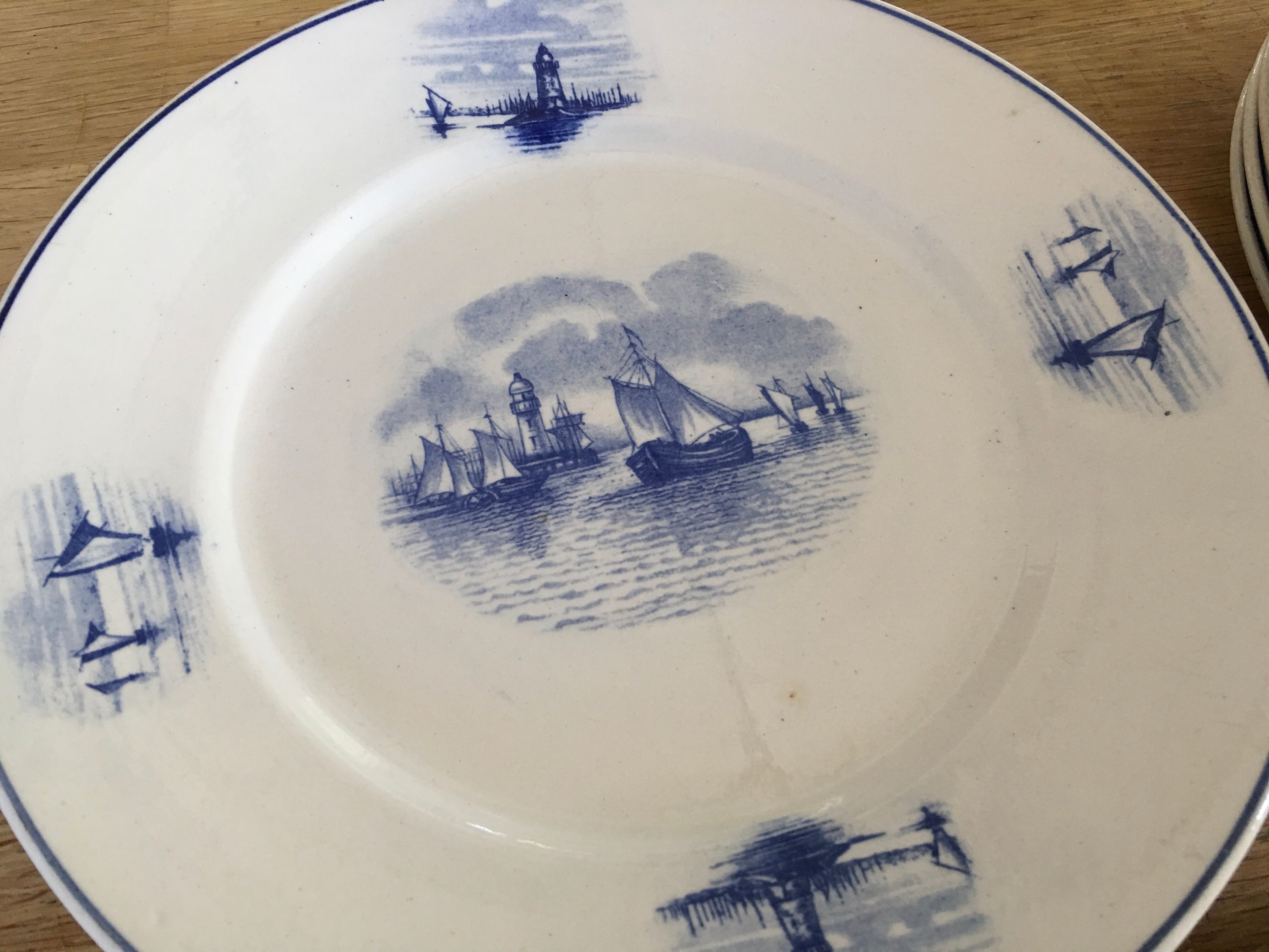 Series of 11 flat plates, Dutch earthenware, early XX