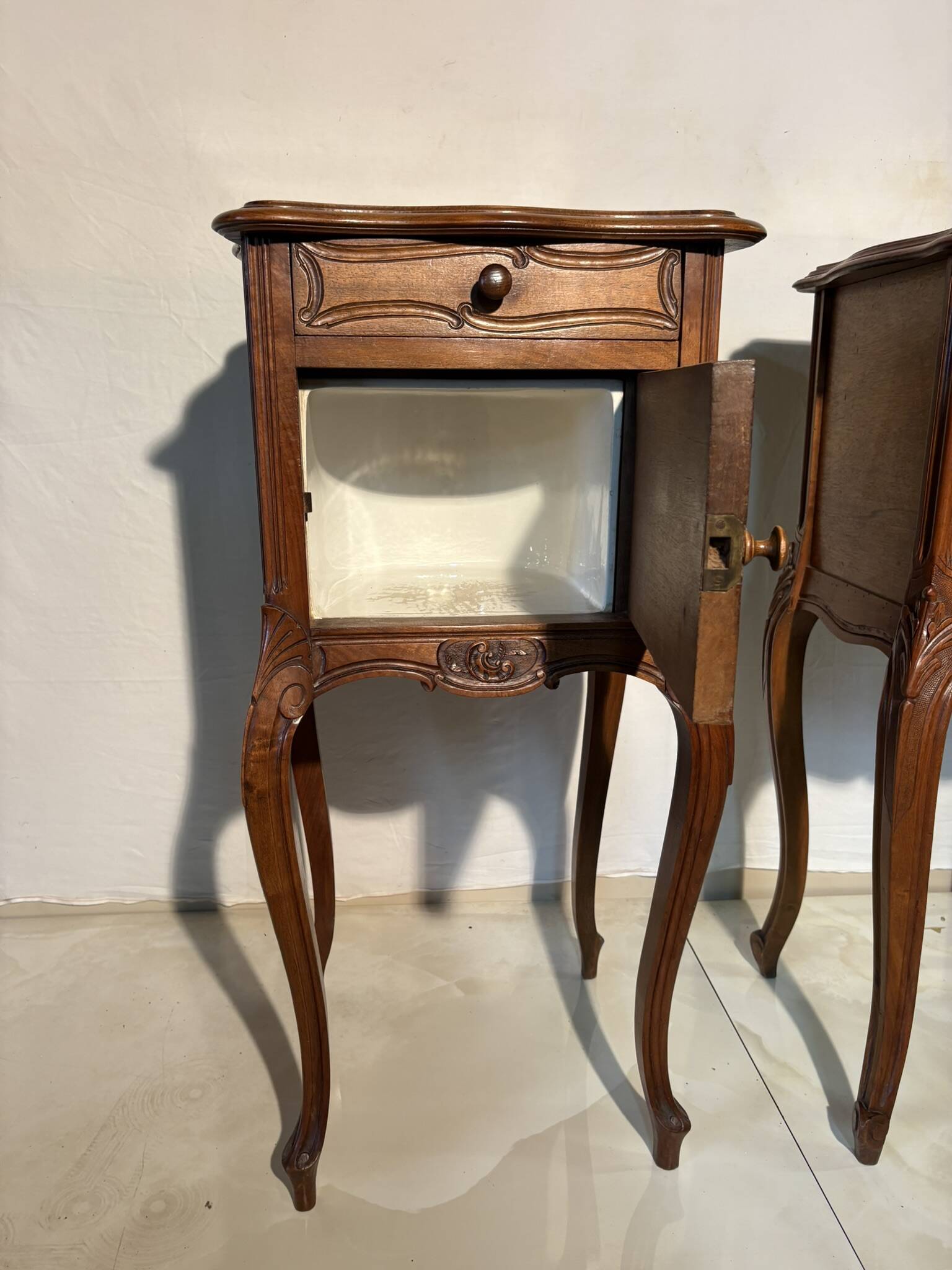 Pair of antique bedside tables with marble top and ceramic niche