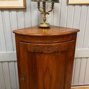Corner cabinet in walnut in the Louis XV style.