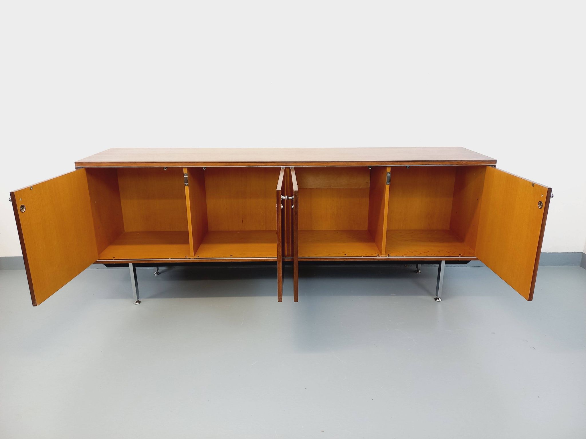 Vintage modernist enfilade in rosewood and chrome metal from the 60s and 70s.