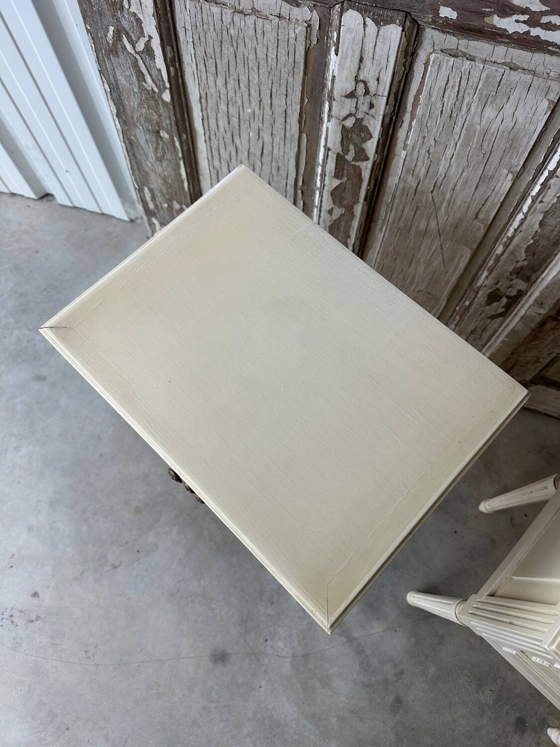 Pair of Louis XVI style bedside tables in white lacquered wood
